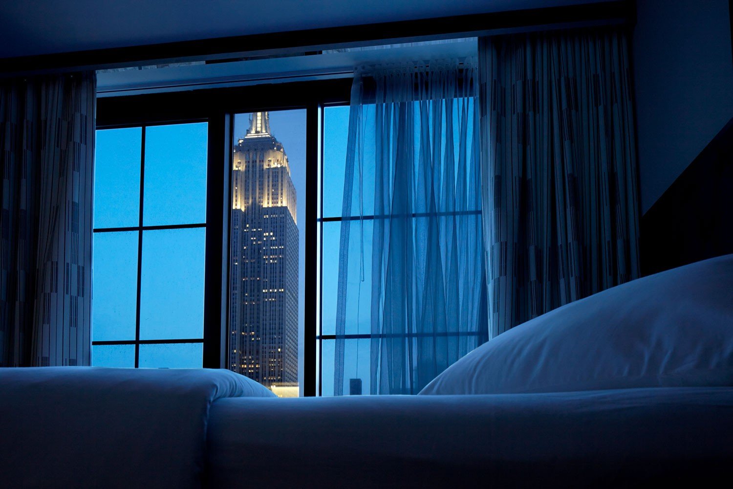 Archer Hotel New York - Empire state building nighttime view from the bedroom