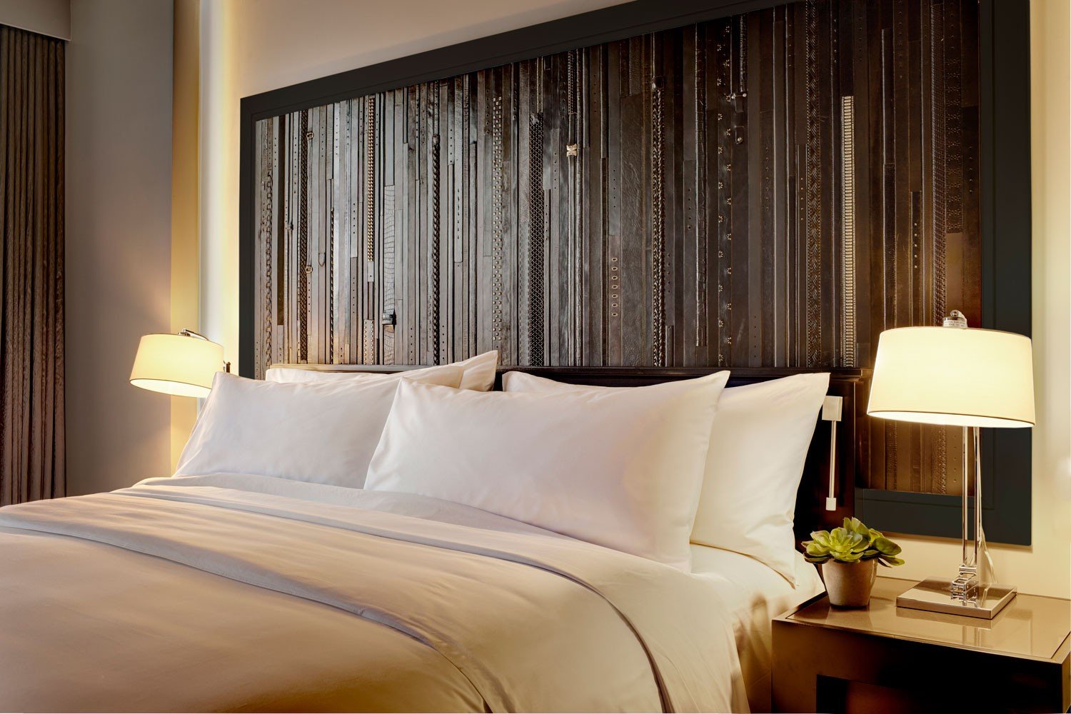 Archer Hotel Austin - King Bed with leather belt wall art