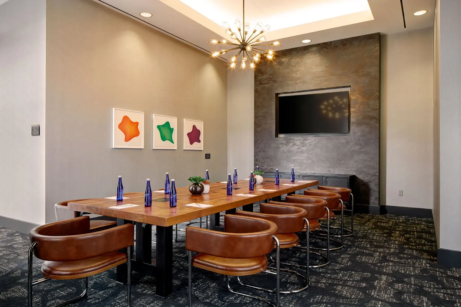 Archer Hotel Burlington - Boardroom seating with water and notepad