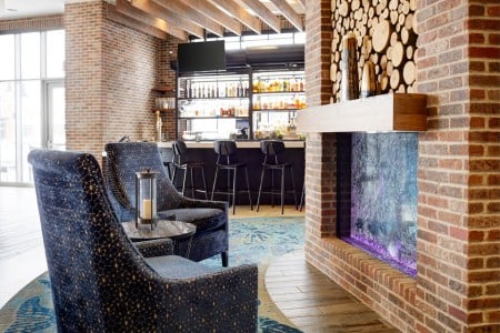 AKB Hotel Bar — Fireplace and blue chairs