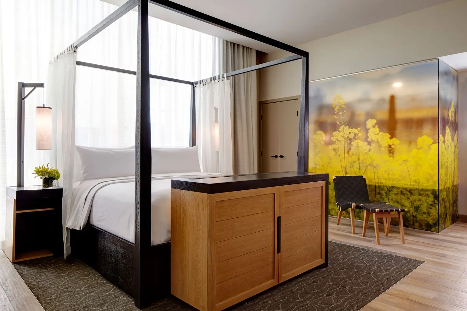 Archer Hotel Napa - Archer's Den bedroom with yellow flowers decorated wall