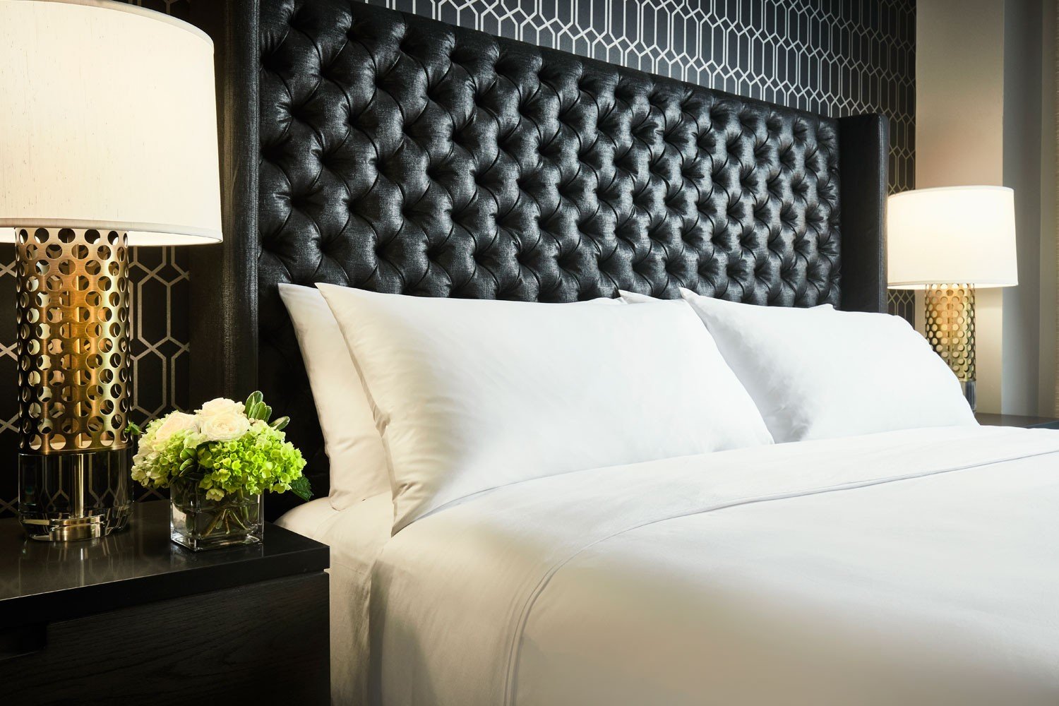 Archer Hotel Tysons - King Suite bed detail with nightstand and flowers