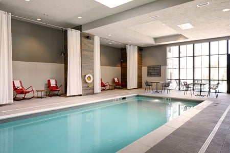 Indoor pool with red rockers