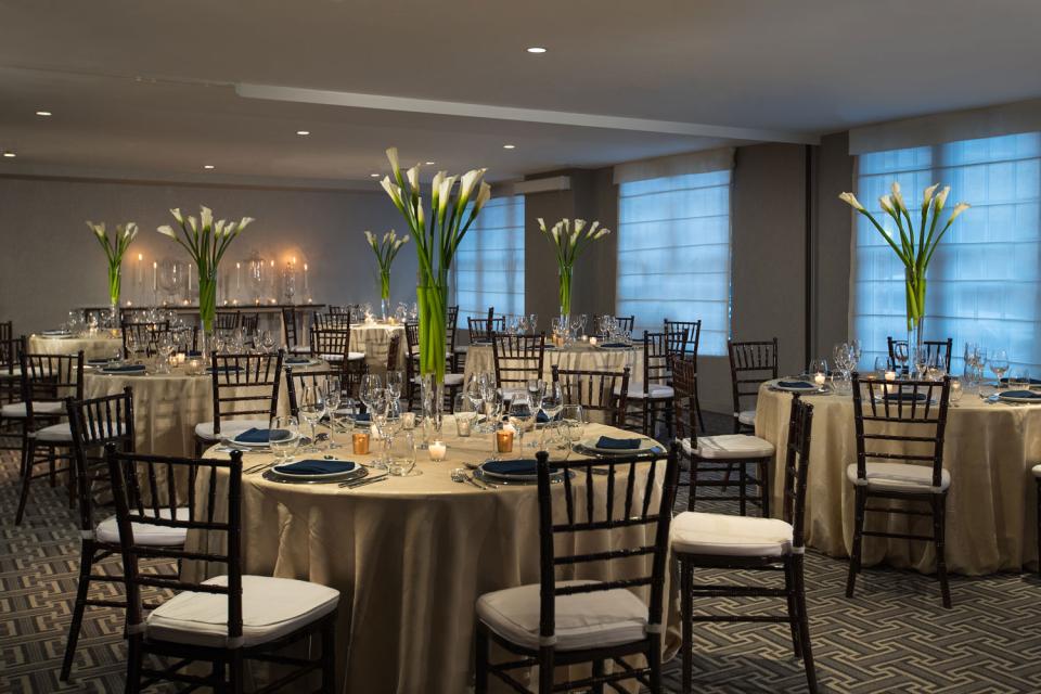 Event set up in the Liberty Ballroom with round tables.