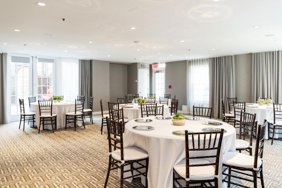 Event set up in the Liberty Ballroom with round tables.