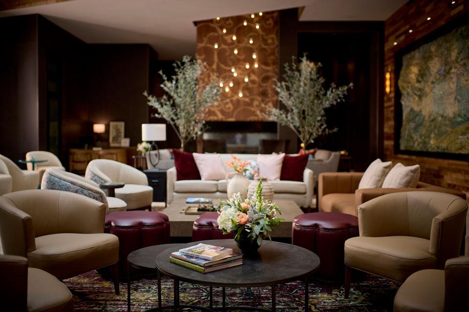 Lobby seating with magazines and flower arrangements