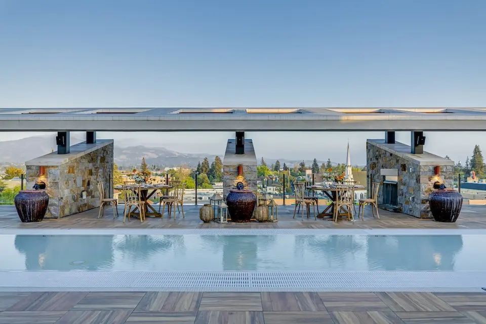 Water Deck - rooftop wedding reception featuring cabana-covered table seating overlooking downtown Napa
