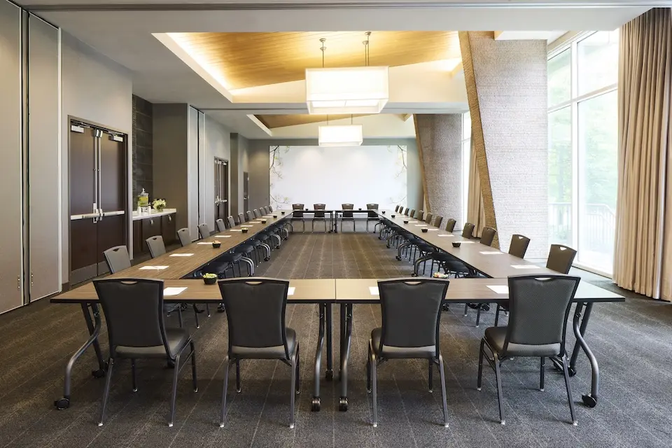 Great Room - meeting venue with hollow square setup, built-in credenza and floor-to-ceiling windows