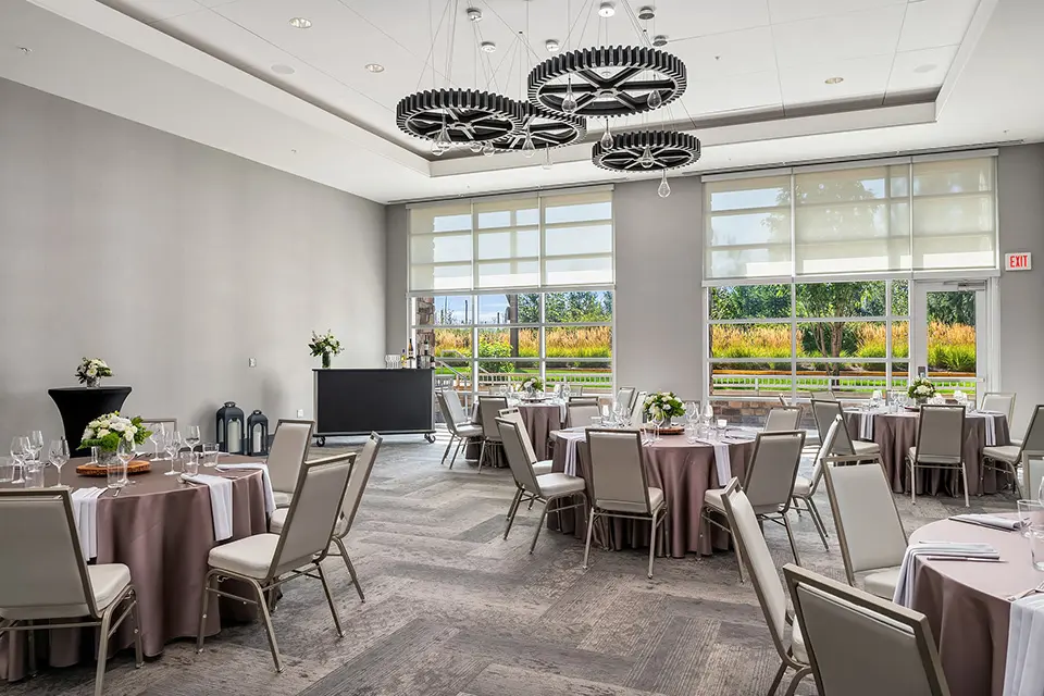 Great Room - banquet with white floral arrangements, dusty mauve-taupe table covers and a portable bar