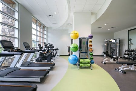 Archer's fitness studio with cardio and lifting equipment 