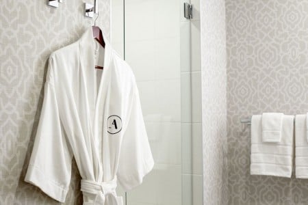 Frette robe hanging by walk-in shower