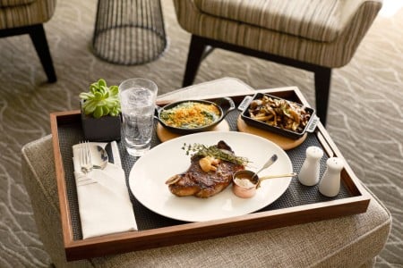 In-room dining from Charlie Palmer Steak - tray with plated food
