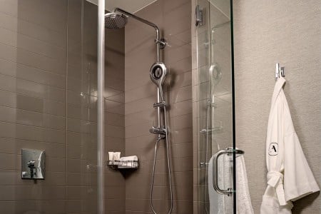 Bathroom walk-in shower and hanging Frette bathrobe