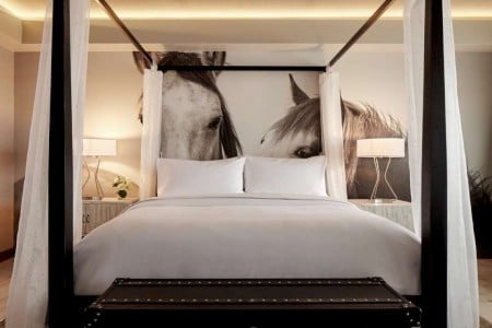 Archer King Suite - four-poster bed with five-star bedding and horse wall mural