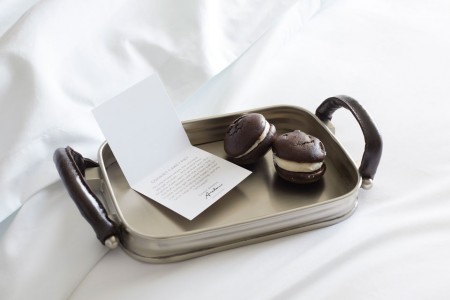 Turndown treat on bed - whoopie pies on a tray with a card