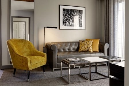 Archer's Den - a chesterfield-style sofa and side chair in the living area