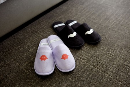 Archer's whimsical slippers with mustaches and lips