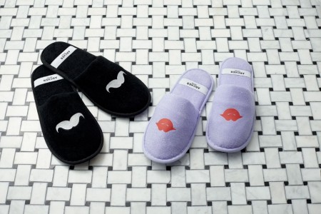 Archer's whimsical slippers with mustaches and lips