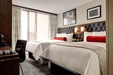 Double Double - two platform beds with five-star bedding and floor-to-ceiling windows