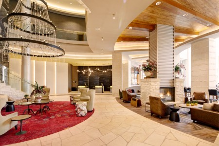 Hotel lobby with front desk and seating areas