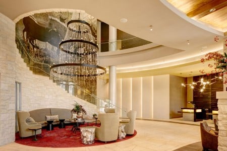 Hotel lobby with chandelier and staircase