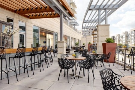 Outdoor patio and bar overlooking Domain NORTHSIDE