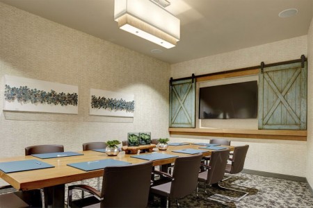 The boardroom — conference table, chairs and TV