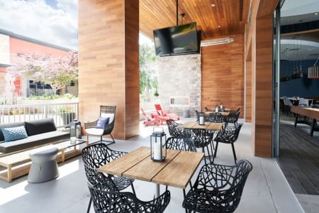Archer's patio with seating and a flat-screen TV