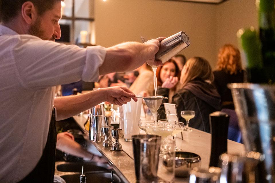 Bartender pouring cocktail at the AKB Hotel Bar