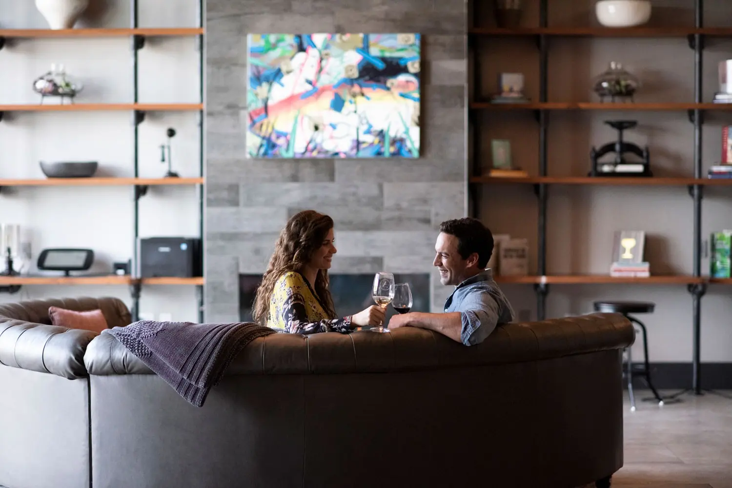 Couple enjoying a glass of win in the lobby of Archer Hotel Florham Park