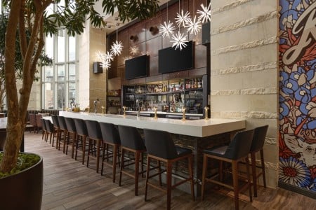 The central bar at AKB in Archer Hotel Austin