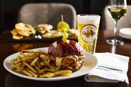 The AKB Cheeseburger with fries and a beer at AKB in Archer Hotel Austin