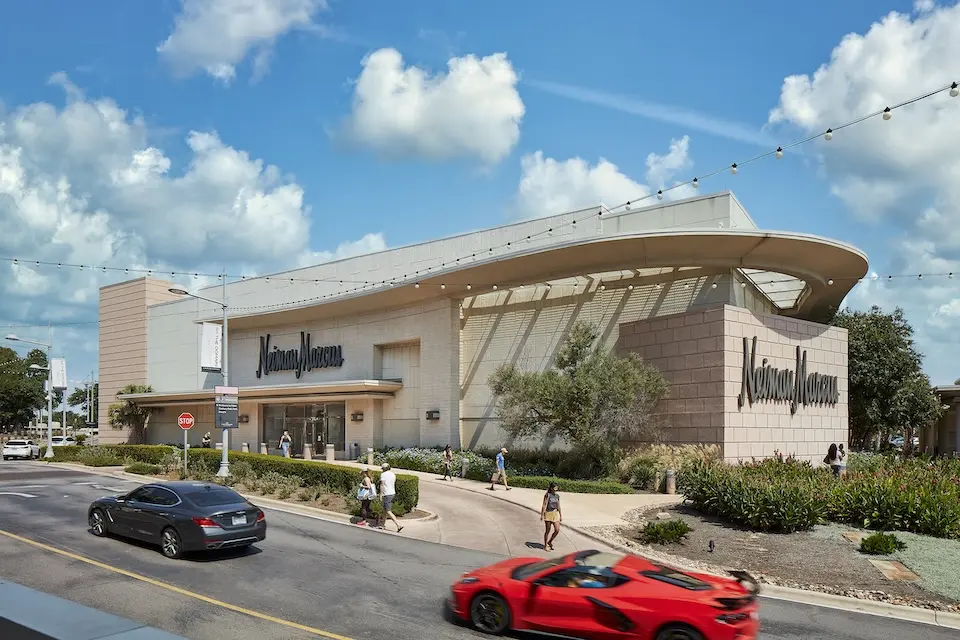 The Domain - cars driving past the main entrance of the Neiman Marcus department store