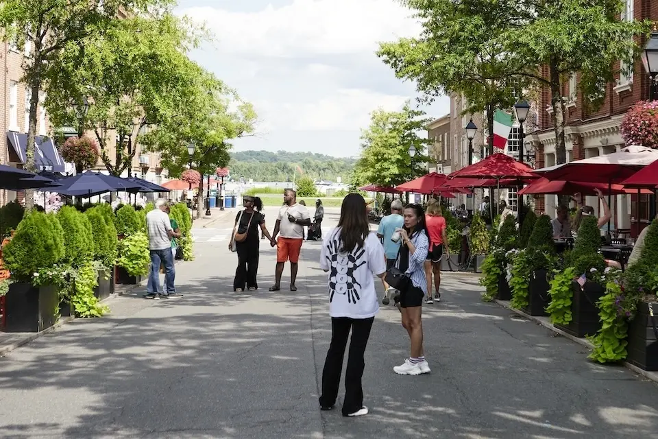 Alexandria Historical District - people walking along King Street, lined with restaurants, shops and outdoor dining