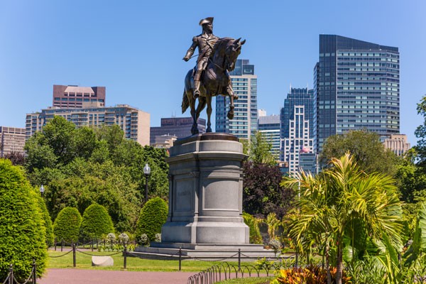 George Washington Statue in the Commons Park with the city in the background 