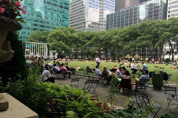 Bryant Park with people sitting on the lawn