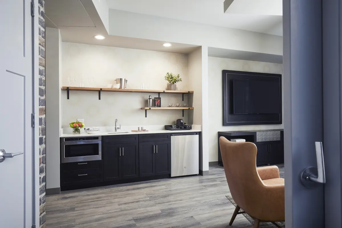 Archer's Den - fully stocked wet bar and wall-mounted TV in the living area