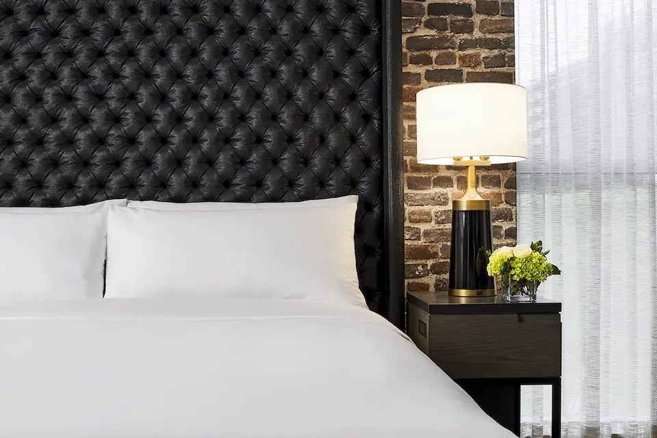 Archer's Den - bedding detail with bedside lighting