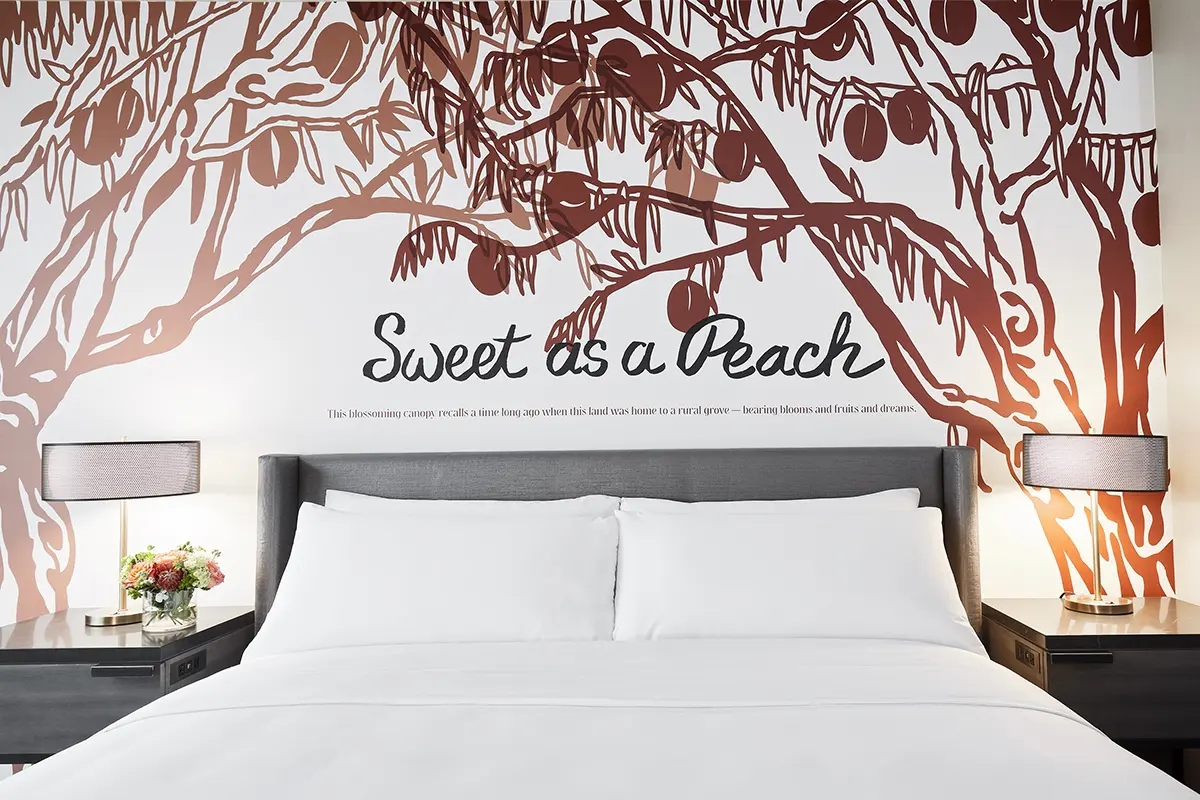 Classic King - bedding detail with 'Sweet as a Peach' mural behind headboard