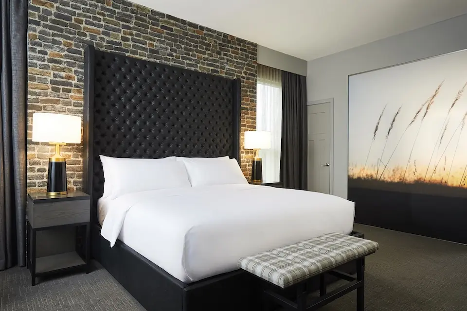 Archer's Den - private bedroom with king platform bed, nightstands and mural