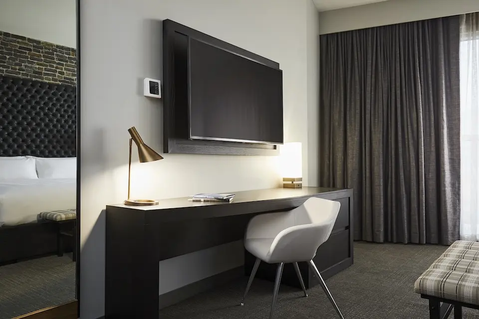 Archer's Den - work desk with white chair and 55-inch flat screen TV