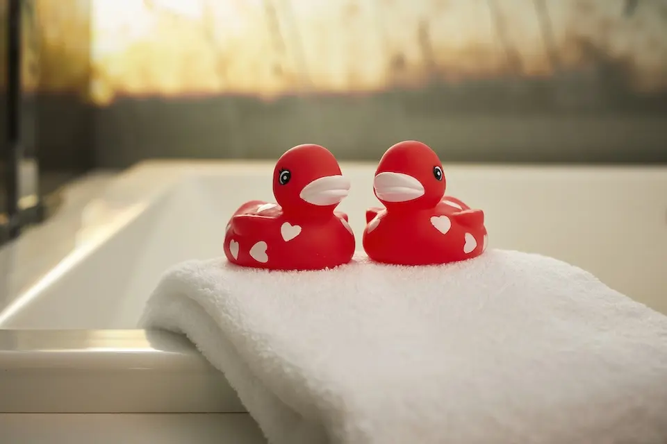 Archer's Den - rubber duckies sitting on edge of soaking tub