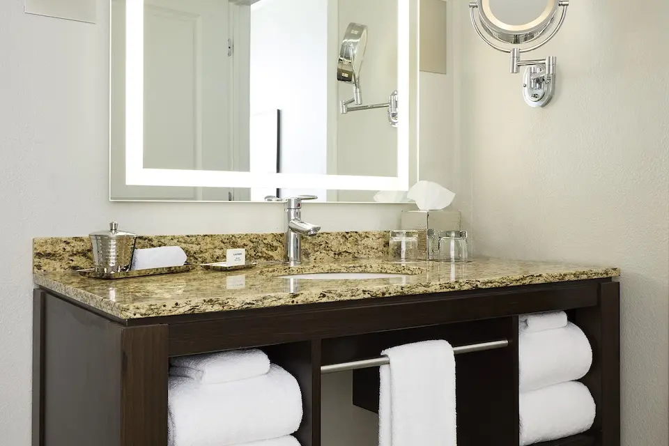 Double King - modern bathroom with granite vanity, lighted mirror and luxury bath amenities