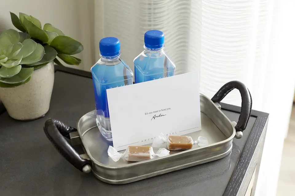 Welcome amenity of complimentary water, salted caramels and card