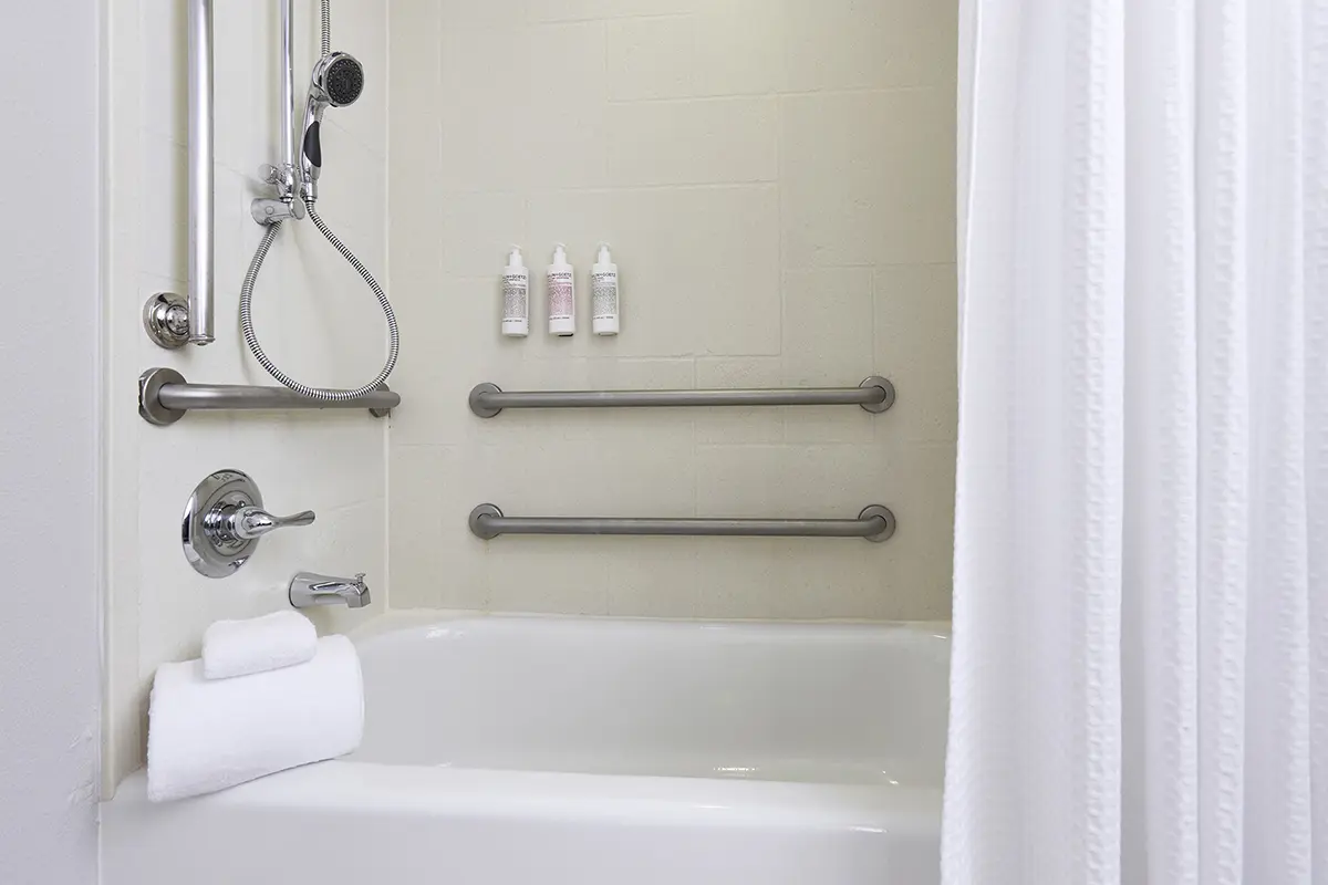 Classic King - mobility-accessible tub with grab bars and adjustable shower wand