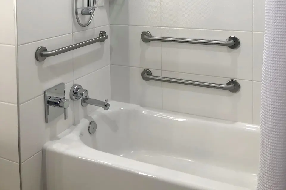 Classic King - mobility-accessible tub with grab bars and adjustable shower wand