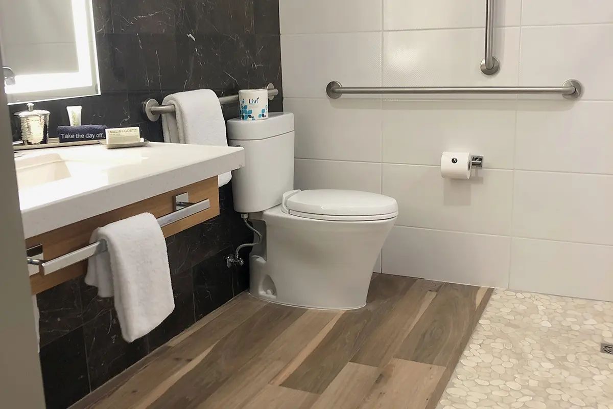 Deluxe King - mobility-accessible bathroom with vanity and grab bars