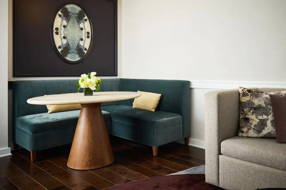 Diplomat Suite living area table at Archer Hotel Alexandria