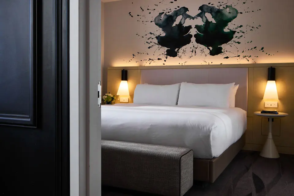 Diplomat Suite - private bedroom with king platform bed