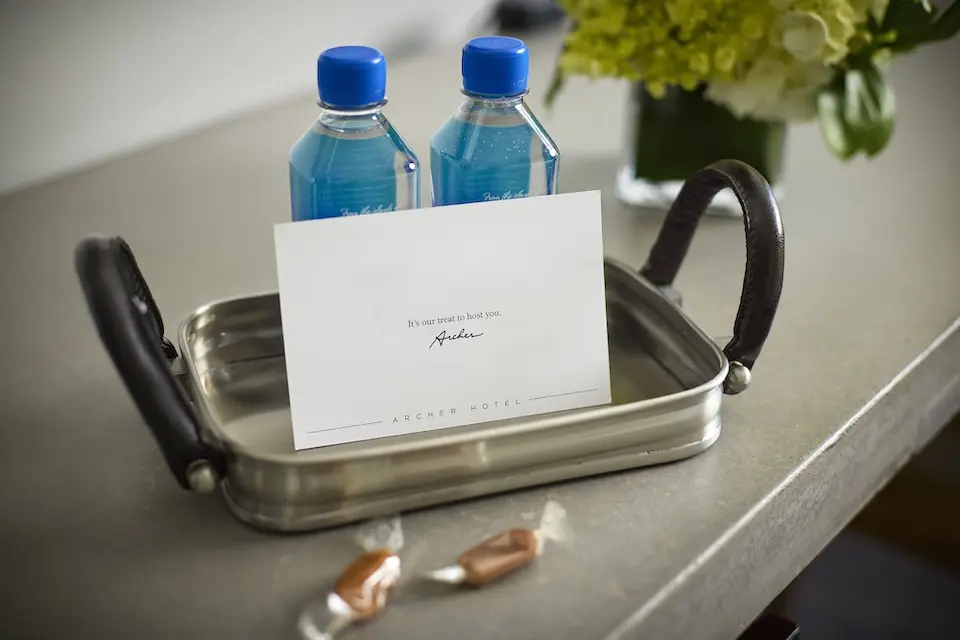 Welcome amenity of complimentary water, salted caramels and card